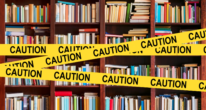 caution tape over books