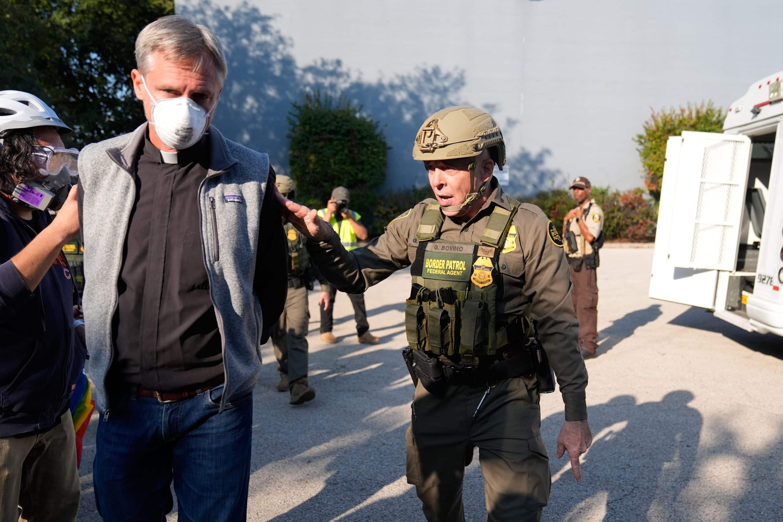 ICE Arrest Priest scaled - Bucks County Beacon - Using Black Hawk Helicopters and Chemical Agents, ICE Agents Turn Chicago Into a 'War Zone'