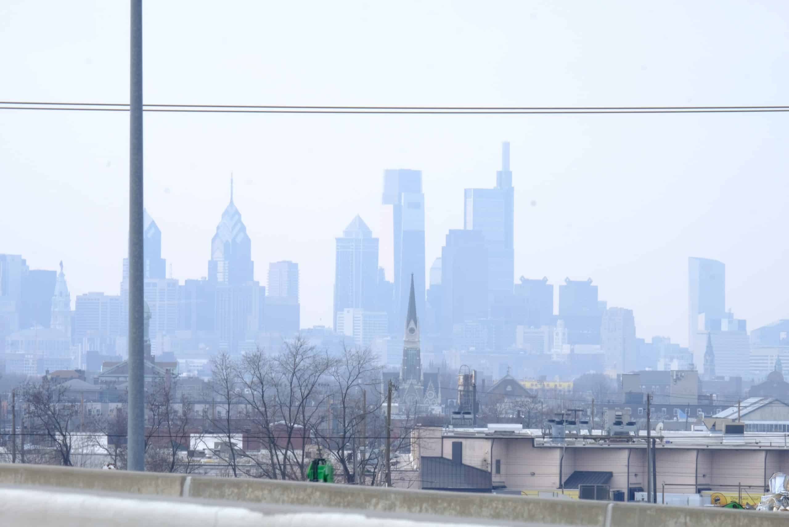 Hazy Philadelphia Skyline scaled - Bucks County Beacon - Downwind: The Shared Cost of Philadelphia’s Trash